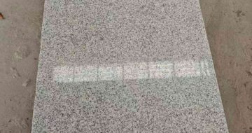 大连芝麻白光面毛板