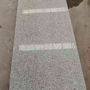 大连芝麻白光面毛板